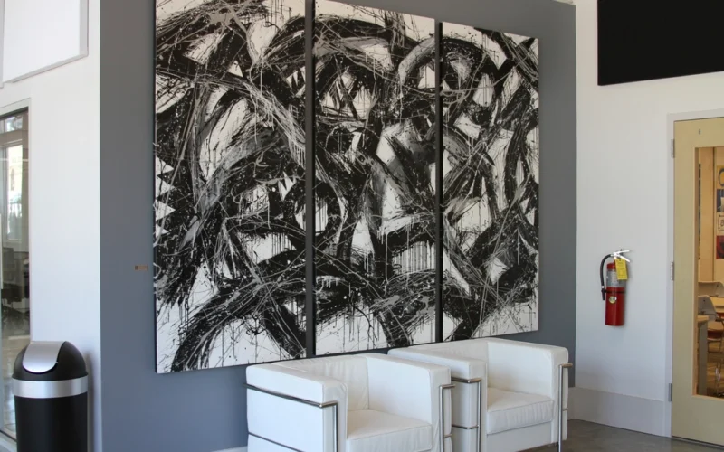 Open art gallery catalogue showing a framed painting plate with title, medium, and price caption
