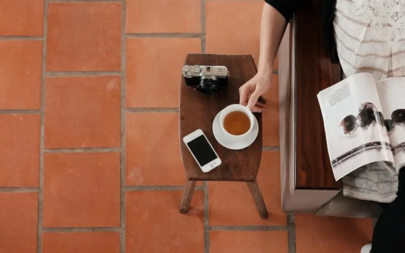 A single-page flyer, a folded brochure, and a multi-page catalogue laid side by side