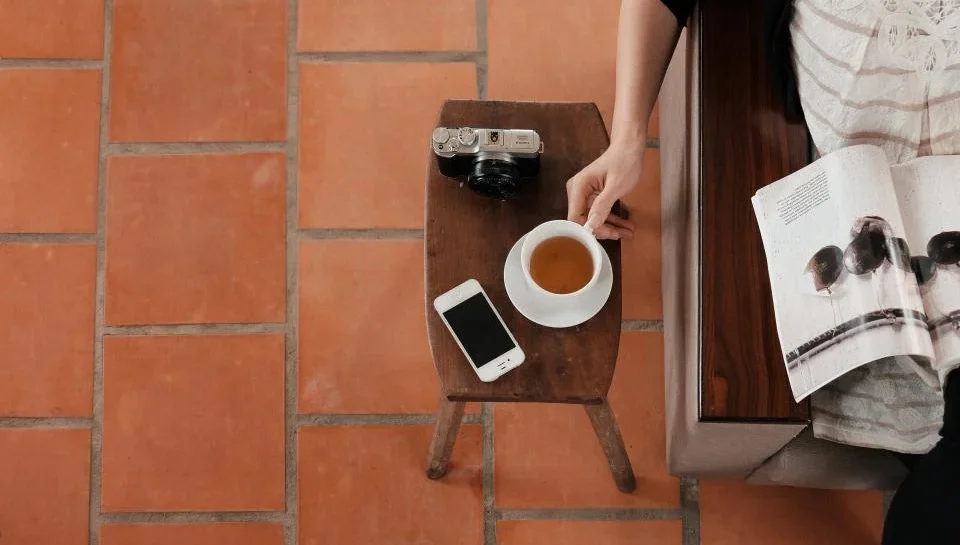 A single-page flyer, a folded brochure, and a multi-page catalogue laid side by side