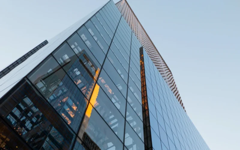 Modern glass office building against the sky