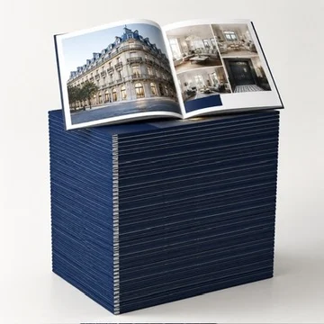 A stack of printed real estate brochures.